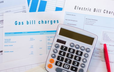 Energy efficiency concept with charges invoice documents on desk