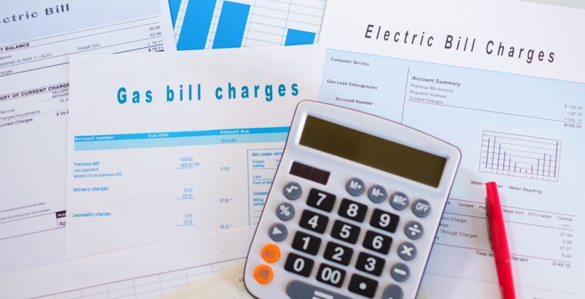 Energy efficiency concept with charges invoice documents on desk