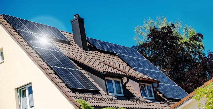 a family house with solar panels on the roof