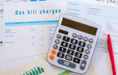 Energy efficiency concept with charges invoice documents on desk