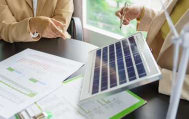 Solar panels green energy Business people working in green eco friendly office business meetingÂ creative ideas for business eco friendly professional teaching corporate people sustainable electricity project business